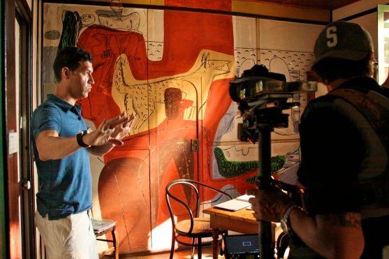 Marco filming documentary in Rebutato's bedroom with painting by Le Corbusier @CelinaLafuenteDeLavotha