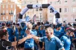 A blue wave of cyclists on the Monaco Palace Square culminating the charity race for the oceans @David Churchill