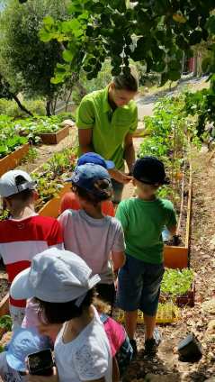 Jessica Sbaraglia and children in one of the vegetable gardens managed by Terre de Monaco @TDM